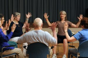 Assisted Living residents stretch together