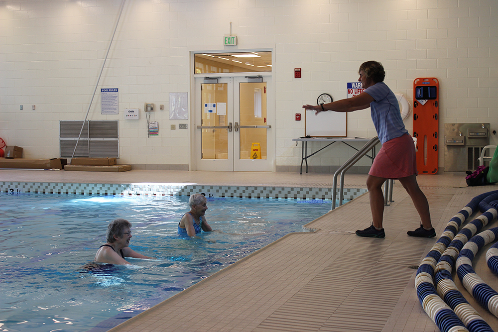 Resident participate in water aerobics
