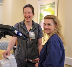 Two female staff members looking at the camera.